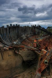 Preview wallpaper remains, boat, framework, stones, cloudy