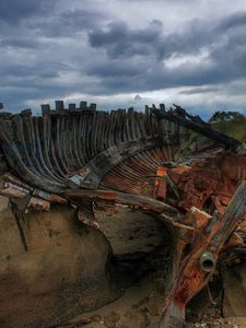 Preview wallpaper remains, boat, framework, stones, cloudy