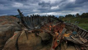 Preview wallpaper remains, boat, framework, stones, cloudy