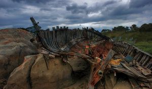 Preview wallpaper remains, boat, framework, stones, cloudy