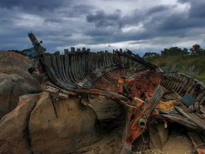 Preview wallpaper remains, boat, framework, stones, cloudy