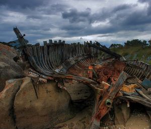 Preview wallpaper remains, boat, framework, stones, cloudy