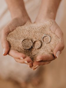 Preview wallpaper rings, hands, sand, palms