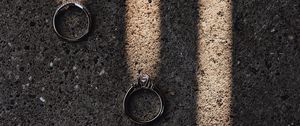 Preview wallpaper rings, rays, asphalt, light