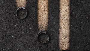 Preview wallpaper rings, rays, asphalt, light