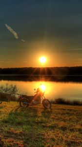 Preview wallpaper river, bike, sunset, grass