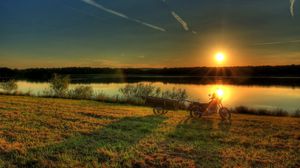 Preview wallpaper river, bike, sunset, grass