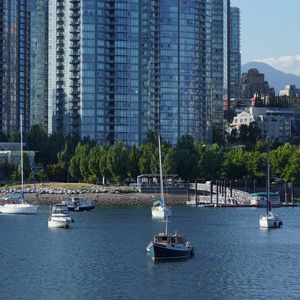 Preview wallpaper river, boats, city, buildings, coast