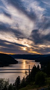 Preview wallpaper river, bridge, sunset, sky, clouds, trees