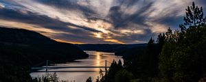 Preview wallpaper river, bridge, sunset, sky, clouds, trees