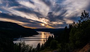 Preview wallpaper river, bridge, sunset, sky, clouds, trees