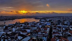 Preview wallpaper river, buildings, houses, city, clouds, sunrise