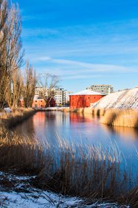 Preview wallpaper river, buildings, snow, winter, grass