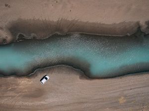 Preview wallpaper river, car, aerial view, shore, sand