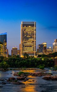 Preview wallpaper river, city, buildings, light, evening, dark