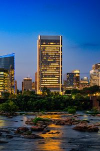 Preview wallpaper river, city, buildings, light, evening, dark