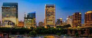 Preview wallpaper river, city, buildings, light, evening, dark