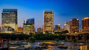 Preview wallpaper river, city, buildings, light, evening, dark