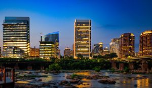 Preview wallpaper river, city, buildings, light, evening, dark