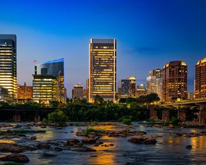 Preview wallpaper river, city, buildings, light, evening, dark