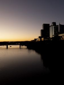 Preview wallpaper river, city, buildings, bridge, dark, shadows