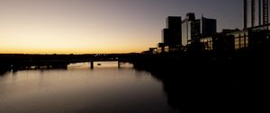 Preview wallpaper river, city, buildings, bridge, dark, shadows