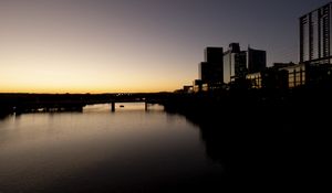 Preview wallpaper river, city, buildings, bridge, dark, shadows