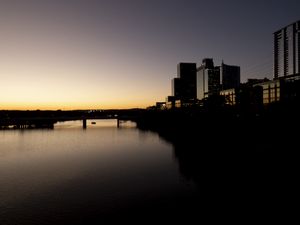 Preview wallpaper river, city, buildings, bridge, dark, shadows