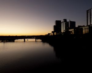 Preview wallpaper river, city, buildings, bridge, dark, shadows