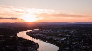 Preview wallpaper river, city, sunset, roofs