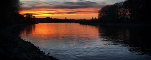 Preview wallpaper river, coast, buildings, silhouettes, evening