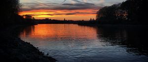 Preview wallpaper river, coast, buildings, silhouettes, evening