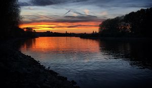 Preview wallpaper river, coast, buildings, silhouettes, evening