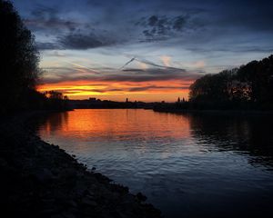 Preview wallpaper river, coast, buildings, silhouettes, evening