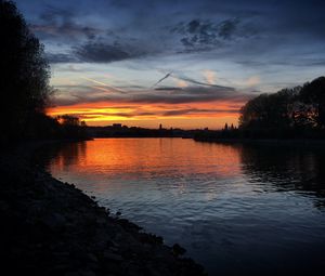 Preview wallpaper river, coast, buildings, silhouettes, evening