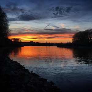 Preview wallpaper river, coast, buildings, silhouettes, evening