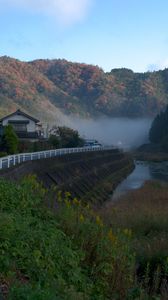 Preview wallpaper river, coast, road, slope, forest, fog