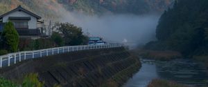 Preview wallpaper river, coast, road, slope, forest, fog