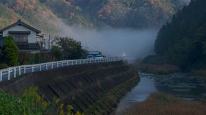 Preview wallpaper river, coast, road, slope, forest, fog