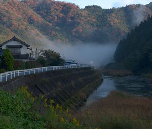 Preview wallpaper river, coast, road, slope, forest, fog