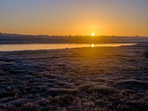 Preview wallpaper river, coast, sunset, sun, landscape