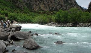 Preview wallpaper river, current, people, tourists, stones, trees, day