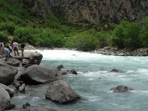 Preview wallpaper river, current, people, tourists, stones, trees, day