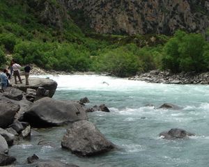 Preview wallpaper river, current, people, tourists, stones, trees, day