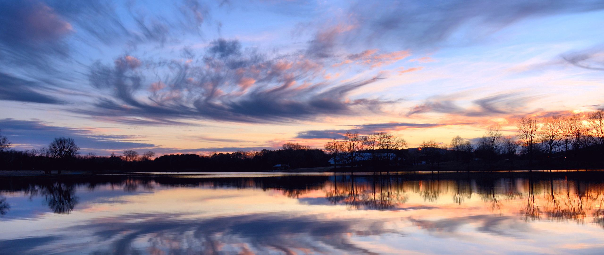 Download wallpaper 2560x1080 river, evening, orange, sunset, sky, trees