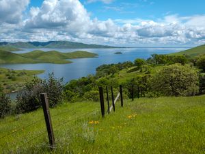 Preview wallpaper river, fence, grass, slope, landscape