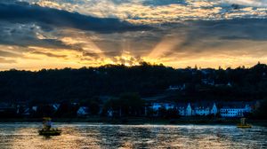 Preview wallpaper river, forest, buildings, sunset, rays, dark