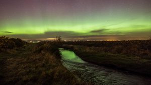 Preview wallpaper river, grass, field, northern lights, lights