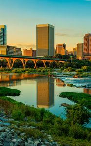 Preview wallpaper river, greens, bridge, buildings, city, sunset