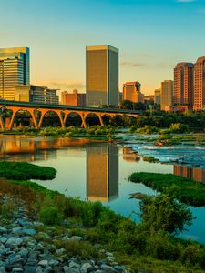 Preview wallpaper river, greens, bridge, buildings, city, sunset